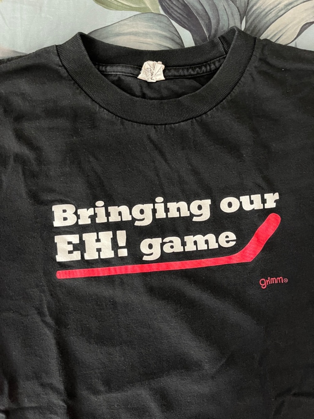 Black "Bringing our EH! game" Graphic Tee
